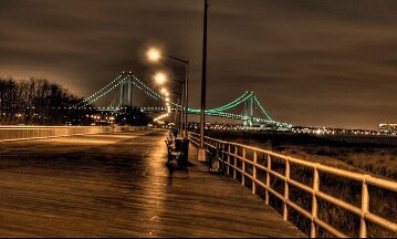 View looking towards chair with a bridge on the background